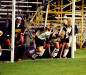 The Fighting Scotts charge out of the cage to defend a corner shot in '06.